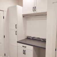 Custom laundry room shelving and cabinetry installation in Meridian, Idaho by Total Home Services.